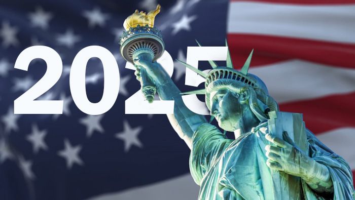 Statue of Liberty with blurred American flag waving in the background